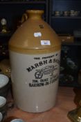 A large stoneware flagon; 'The property of Marsh and sons, 266, Duke street, Barrow in Furness'.