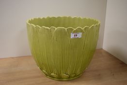 A Burmantofts Faience vintage green planter in the form of a flower.