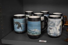 A collection of Ambleside pottery mugs, various designs, including otter, blue tit and Lake district