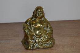 A vintage cast brass Buddha figure.