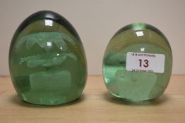 Two Victorian dump weights, having floral sulphide inclusions.