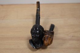 A hand carved imported briar pipe in the form of a horses head and another similar in the form of