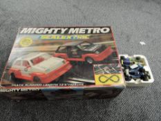 A Hornby Scalextric C580 Mighty Metro Racing Set, appears complete, box damaged along with four