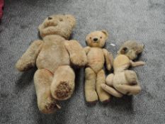 A mid 20th century straw filled yellow plush Teddy Bear having stitched nose and mouth, plastic