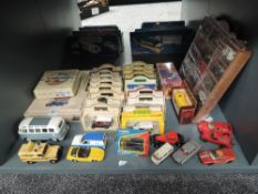 A shelf of modern diecasts including Lledo, Corgi, Matchbox etc, most boxed or on display shelf,