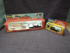 Two Dinky diecast sets, 277 Police Land Rover and 299 Police Crash Quad, both appear complete in