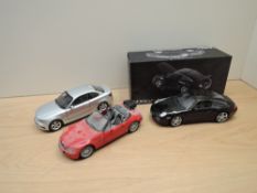 Three modern 1:18 scale diecasts, Norev Porsche 911 4S boxed, Kyosho BMW1 Series Coupe and UT Models