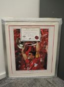 A framed & glazed Liverpool FC Steven Gerrard Champions of Europe Photograph, bearing signature,