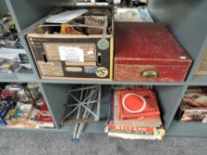 Two shelves of mixed vintage playworn Meccano including early red and green in fitted wooden box,