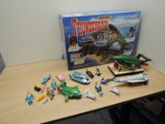 A Matchbox TB710 Thunderbirds Tracy Island Electronic Play Set in original box along with figures