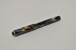 A Conway Stewart Dinkie 540 ring top lever fill fountain pen in "confetti" colours having Conway