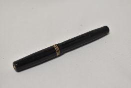 A Mabie Todd Swan 1060 twist fill fountain pen in black with three narrow band to the cap having
