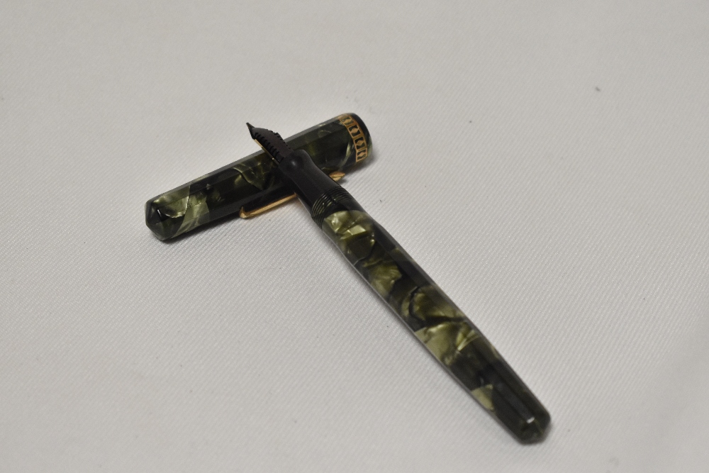An Eversharp Doric lever fill fountain pen in green marble with dodecahedron faceted cap and barrel, - Image 2 of 4