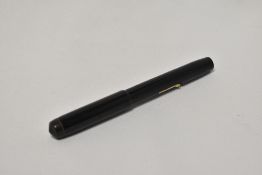 A Conway Stewart 475 lever fill fountain pen in black having Conway Stewart 14ct nib . Slight damage