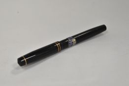 A Burnham 214F button fill fountain pen in black with two narrow bands to the cap having Burnham