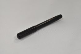 A Conway Stewart Dinkie lever fill fountain pen in BHR having Conway Stewart 14ct nib. Crack to