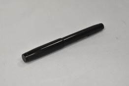 A De La Rue lever fill fountain pen in black having Warrented 14ct nib