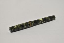 A Mabie Todd Swan lever fill fountain pen in green marble with three narrow bands to the cap