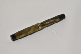 An Onoto the Pen 5123/6.7 by De La Rue in green marble piston fill fountain pen with two narrow