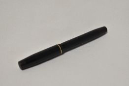 An Onoto the Pen C7 by De La Rue in BHR piston fill fountain pen with engine turn design with single