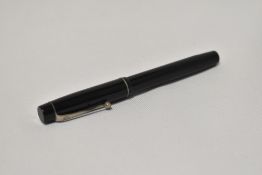 An Onoto the Pen 4601 by De La Rue piston fill fountain pen in black with two narrow bands to the