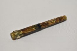A Waterman Ideal lever fill fountain pen in ripple effect. Condition appears to have cap band