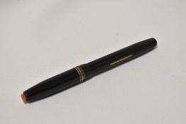 A Kendrick & Jefferson lever fill fountain pen in black with one broad and 2 narrow bands to the cap