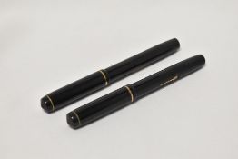 Two Conway Stewart 286 lever fill fountain pens both in black with single narrow band to the cap