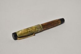 A Parker Duofold Moderne button fill fountain pen in green and pearl with three narrow band to the