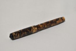 A Unique lever fill fountain pen in brown and gold marble with 2 narrow bands to the cap having