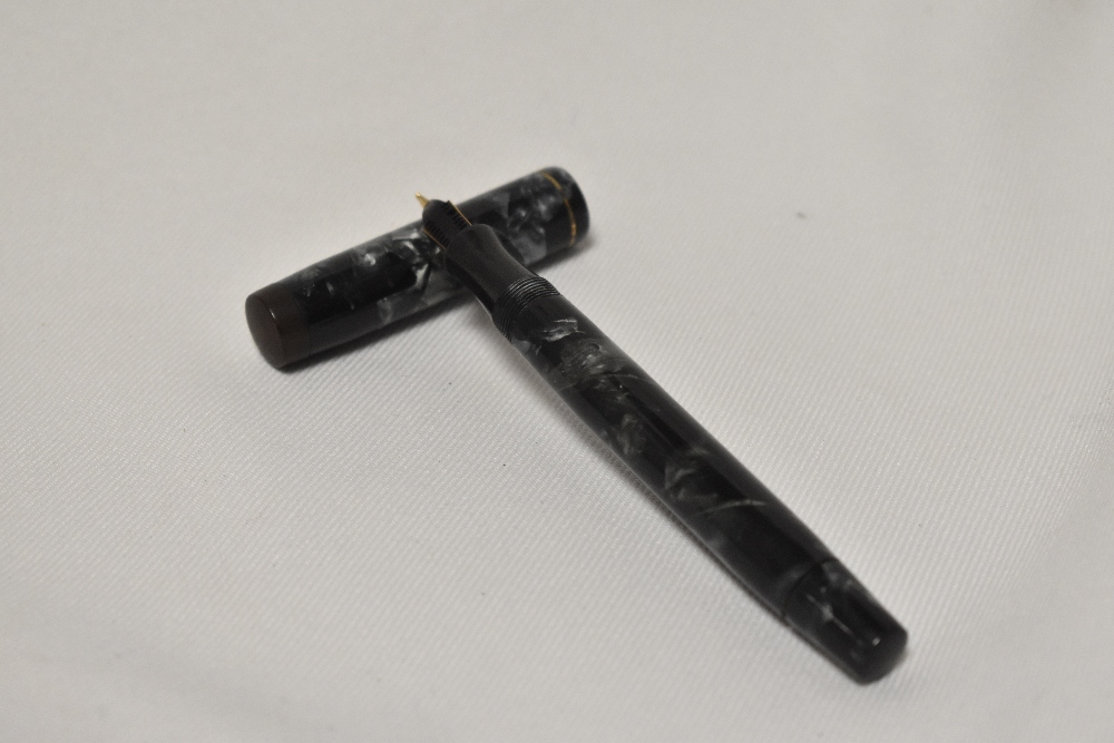 A Mentmore Auto-Flow button fill fountain pen in black and grey marble with single narrow band to - Image 2 of 3