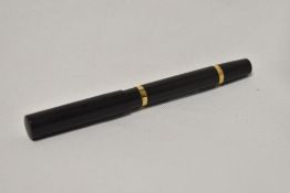 A Mabie Todd Blackbird self filler lever fill fountain pen in BHR with engine turned hoop design and