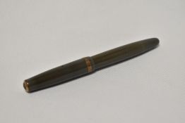 A Parker Duofold button fill fountain pen in sage green with broad decorative band to the cap having