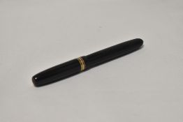 A Mabie Todd Swan twist fill fountain pen in black with one broad and two narrow bands to the cap