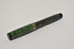 A Parker Duofold Jr button fill fountain pen in sage green with two narrow bands to the cap having