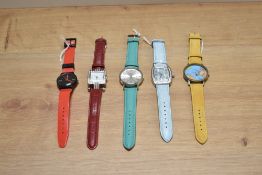 An assorted collection of wristwatches with coloured wrist straps, including Citron and Identity