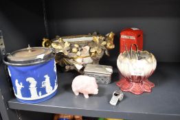An ornate Moor & Co gilt flower encrusted centerpiece, a Wedgwood Jasperware biscuit jar, a rose