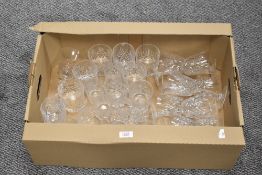 A carton of assorted cut glass drinking glasses.