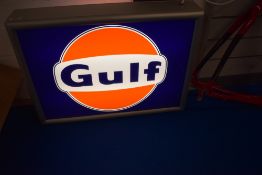 A double sided Gulf advertising light box.