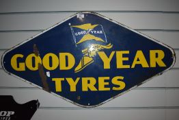 A vintage enamel Good Year Tyres advertising sign.
