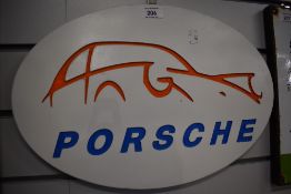 A reproduction Porsche wall plaque.