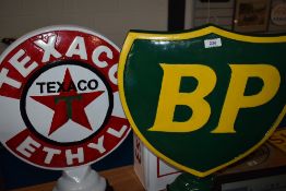 A reproduction BP sign and a Texaco sign.