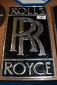 A reproduction Rolls Royce plaque.