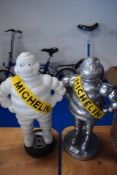 Two reproduction Michelin men.