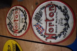 Two reproduction Norton plaques.