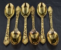 A set of six Queen Elizabeth II silver gilt table or dessert spoons, having oval bowls, cast and