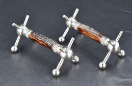 A pair of silver plate and antler knife rests, of traditional design with antler 'rests' 10cm