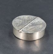 A Queen Elizabeth II 925 grade white metal pill box, of circular form with two hinged demi-lune