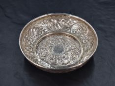 A Edwardian silver dish, of circular form having shallow pressed circular base and rolled rim,