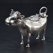 A fine Victorian silver cow creamer, of stylised form with inset red glass eyes, slightly opened